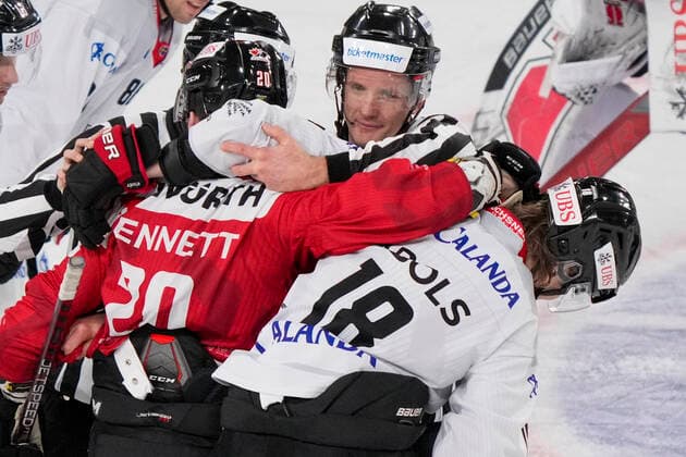 DAVOS, SWITZERLAND - DECEMBER 29: Kristopher Bennett of Team Canada (L) against Rodrigo Abols of Örebro HK (R) during the match between Orebro HK and Team Canada at Eisstadion Davos on December 28, 2022 in Davos, Switzerland. Davos Graubunden Switzerland Copyright: xJustPictures.ch JarixPestelaccix