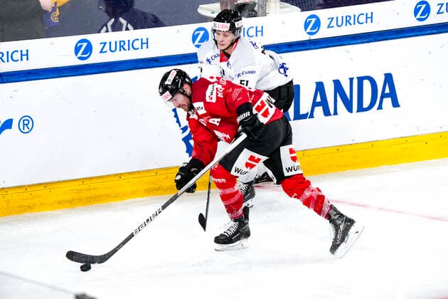 DAVOS, SWITZERLAND - DECEMBER 29: Chris Didomenico of Team Canada (L) against Kristian Nakyva of Örebro HK (R) during the match between Orebro HK and Team Canada at Eisstadion Davos on December 28, 2022 in Davos, Switzerland. Davos Graubunden Switzerland Copyright: xJustPictures.ch JarixPestelaccix