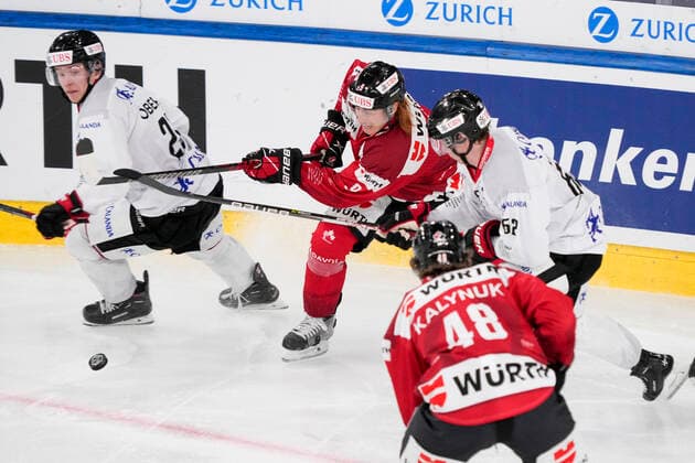 DAVOS, SWITZERLAND - DECEMBER 29: Cody Eakin of Team Canada (C) against Robert Leino of Örebro HK (behind Cody Eakin) during the match between Orebro HK and Team Canada at Eisstadion Davos on December 28, 2022 in Davos, Switzerland. Davos Graubunden Switzerland Copyright: xJustPictures.ch JarixPestelaccix