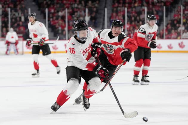 December 29, 2022, Halifax, NS, Canada: Canada™s Connor Bedard, left, and Austria™s Lukas Horl battle for possession of the puck during second period IIHF World Junior Hockey Championship action in Halifax on Thursday, December 29, 2022. Connor Bedard, Lukas Horl  - ZUMAc35_ 20221229_zaf_c35_062 Copyright: xDarrenxCalabresex