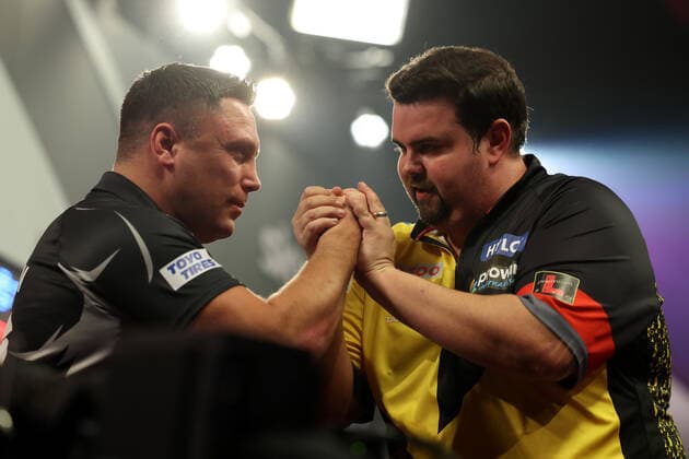 Sport Themen der Woche KW52 Sport Bilder des Tages 1st January 2023, Alexandra Palace, London, England; 2022 23 PDC Cazoo World Darts Championships Day 14 Evening Session; Gabriel Clemens consoles Gerwyn Price after he wins the match 1-5  ActionPlus12463681 ShaunxBrooks