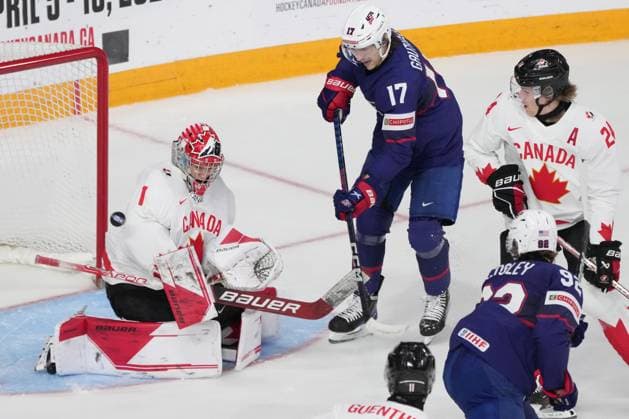 January 4, 2023, Halifax, NS, Canada: Canada goaltender Thomas Milic, left, makes a save as USA s Cutter Gauthier, centre, looks for a rebound during first period IIHF World Junior Hockey Championship semifinal action in Halifax on Wednesday, January 4, 2023. Cutter Gauthier, Thomas Milic - ZUMAc35_ 20230104_zaf_c35_096 Copyright: xDarrenxCalabresex