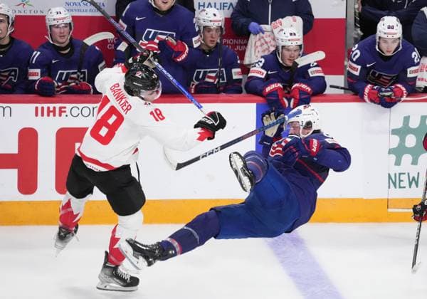 January 4, 2023, Halifax, NS, Canada: Canada s Caedan Bankier, left, checks USA s Charlie Stramel during first period IIHF World Junior Hockey Championship semifinal action in Halifax on Wednesday, January 4, 2023. Caedan Bankier, Charlie Stramel  - ZUMAc35_ 20230104_zaf_c35_099 Copyright: xDarrenxCalabresex