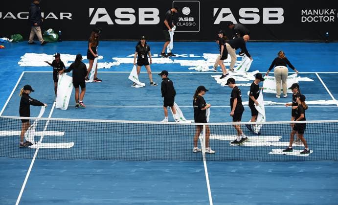 5th January 2022: Auckland, New Zealand: Ball kids dry Centre court during on Day 4 of the 2023 Womens s ASB Classic. ASB Tennis Centre, Auckland, New Zealand.  ActionPlus12464873 ChrisxSymes
