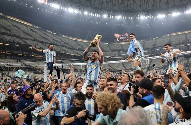 (230110) -- BEIJING, Jan. 10, 2023 -- Lionel Messi (top, 2nd L) of Argentina celebrates with the World Cup Trophy after the awarding ceremony of the 2022 FIFA World Cup, WM, Weltmeisterschaft, Fussball at Lusail Stadium in Lusail, Qatar, Dec. 18, 2022. ) (SP)XINHUA-PICTURES OF THE YEAR 2022 CaoxCan 