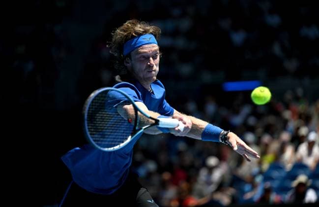 TENNIS AUSTRALIAN OPEN, Andrey Rublev of Russia returns to Dominic Them of Austria during their fist round match at the 2023 Australian Open tennis tournament at Melbourne Park in Melbourne, Tuesday, January 17, 2023. ( NO ARCHIVING, EDITORIAL USE ONLY, NO USE IN BOOKS WITHOUT CONSENT MELBOURNE VICTORIA AUSTRALIA  Copyright: xLUKASxCOCHx 20230117001753356251