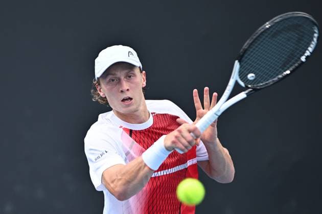 TENNIS AUSTRALIAN OPEN, Emil Ruusuvuori of Finland returns during his 1st round singles match against Max Purcell of Australia during 2023 Australian Open tennis tournament at Melbourne Park in Melbourne, Tuesday, January 17, 2023. ( NO ARCHIVING, EDITORIAL USE ONLY, NO USE IN BOOKS WITHOUT CONSENT MELBOURNE VICTORIA AUSTRALIA  Copyright: xJOELxCARRETTx 20230117001753460511
