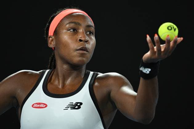TENNIS AUSTRALIAN OPEN, Coco Gauff of the U.S. serves during her match against Emma Raducanu of Great Britain during the 2023 Australian Open tennis tournament at Melbourne Park in Melbourne, Wednesday, January 18, 2023. ( NO ARCHIVING, EDITORIAL USE ONLY, NO USE IN BOOKS WITHOUT CONSENT MELBOURNE VICTORIA AUSTRALIA  Copyright: xJAMESxROSSx 20230118001753806035