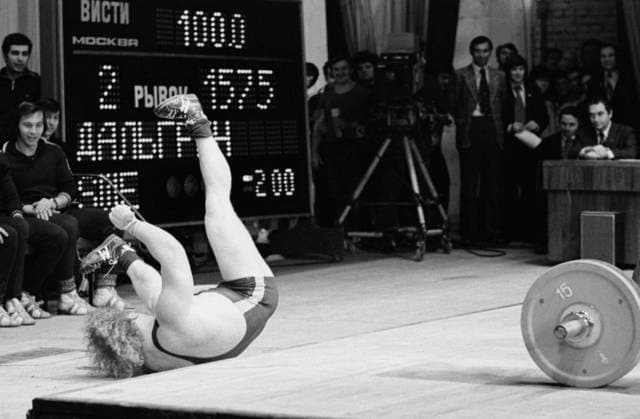 March 16-20, 1978. Moscow, USSR. Swedish weightlifter Dahlgren Lennart lies on the platform after an unsuccessful attempt at the International Weightlifting Tournament for the Friendship Cup at the Palace of Culture of the 1st Moscow Bearing Plant. The exact date of the photograph is unknown. Alexander Yakovlev TASS  16938513