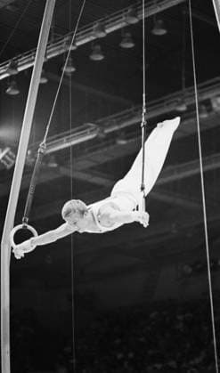 September, 1975. Leningrad, USSR. Multiple world, European and USSR champion, Olympic champion, captain of the Soviet gymnastics team Nikolai Andrianov perfoms on the rings. The exact date of the photograph is unknown. Nikolai Naumenkov TASS  19486239