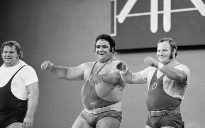 Montreal, Canada. Athletes Gerd Bonk (German Democratic Republic, silver), Vasily Alexeyev (USSR, gold) and Helmut Losch (GDR, bronze) (L-R) stand on the Olympic podium during the award ceremony of the men s +110 kg weightlifting event medalists at the 1976 Summer Olympics at the St. Michel Arena. Viktor Budan, Yashar Khalilov TASS  32037765