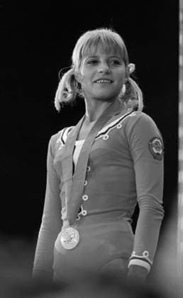 August 15-25 , 1973 Moscow, USSR. Soviet gymnast Olga Korbut, who won a bronze medal in the women s vault event, participates in the awarding ceremony of the World University Games at the Lenin Central Stadium. The exact date of the photograph is unknown. Nikolai Naumenkov TASS  32435621