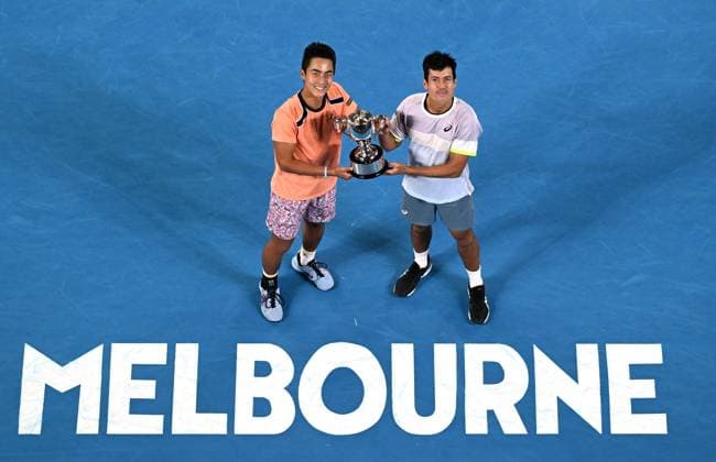TENNIS AUSTRALIAN OPEN, Australian?s Rinky Hijikata (left) and Jason Kubler pose for photographs after winning the men?s doubles final against Hugo Nys of Monaco and Jan Zielinski of Poland at the 2023 Australian Open tennis championship at Melbourne Park in Melbourne, Saturday, January 28, 2023. ( NO ARCHIVING, EDITORIAL USE ONLY, NO USE IN BOOKS WITHOUT CONSENT MELBOURNE VICTORIA AUSTRALIA  Copyright: xLUKASxCOCHx 20230129001757547512