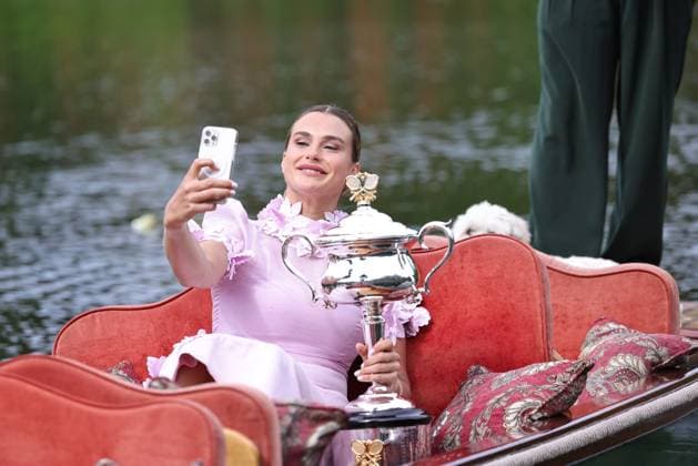 Aryna Sabalenka, BLR, presenting her trophy during a photoshoot in the botanical gardens after 2023 Australian Open in Melbourne, 29 01 2023; -