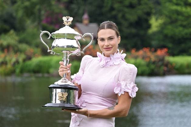 Aryna Sabalenka, BLR, presenting her trophy during a photoshoot in the botanical gardens after 2023 Australian Open in Melbourne, 29 01 2023; -
