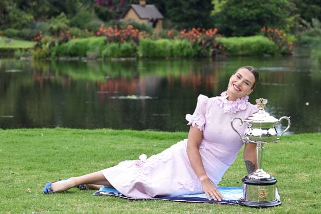 Aryna Sabalenka, BLR, presenting her trophy during a photoshoot in the botanical gardens after 2023 Australian Open in Melbourne, 29 01 2023; -
