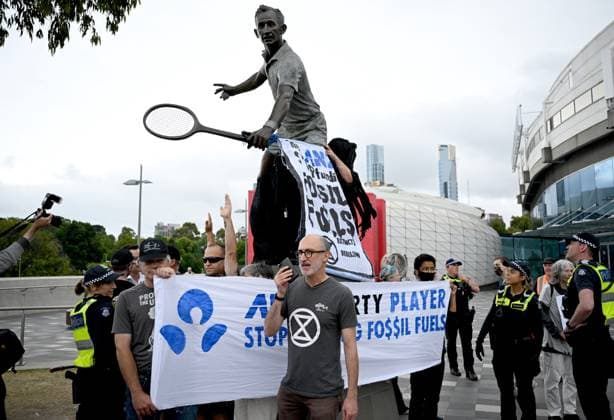 TENNIS AUSTRALIAN OPEN, Extinction Rebellion protesters are removed during a protest at the statue of Rod Laver at the 2023 Australian Open tennis championship at Melbourne Park in Melbourne, Sunday, January 29, 2023. ( NO ARCHIVING, EDITORIAL USE ONLY, NO USE IN BOOKS WITHOUT CONSENT MELBOURNE VICTORIA AUSTRALIA  Copyright: xJamesxRossx 20230129001757858262