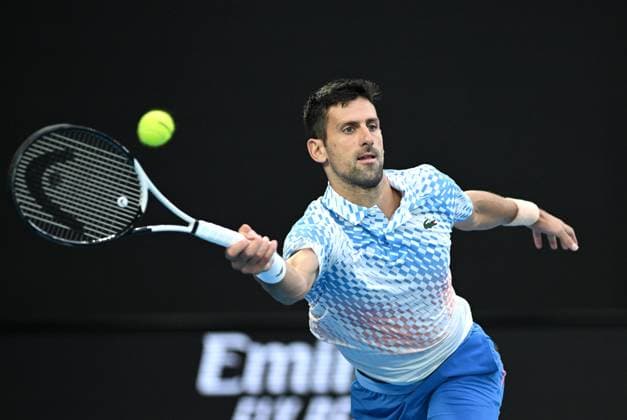 TENNIS AUSTRALIAN OPEN, Novak Djokovic of Serbia returns to Stefanos Tsitsipas of Greece during the men?s singles final at the 2023 Australian Open tennis championship at Melbourne Park in Melbourne, Sunday, January 29, 2023. ( NO ARCHIVING, EDITORIAL USE ONLY, NO USE IN BOOKS WITHOUT CONSENT MELBOURNE VICTORIA AUSTRALIA  Copyright: xJamesxRossx 20230129001757874887