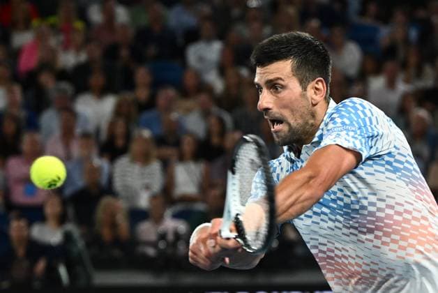 TENNIS AUSTRALIAN OPEN, Novak Djokovic of Serbia in action during the Men?s Singles Final against Stefanos Tsitsipas of Greece at the 2023 Australian Open tennis tournament at Melbourne Park in Melbourne, Sunday, January 29, 2023. ( NO ARCHIVING, EDITORIAL USE ONLY, NO USE IN BOOKS WITHOUT CONSENT MELBOURNE VICTORIA AUSTRALIA  Copyright: xJOELxCARRETTx 20230129001757893448