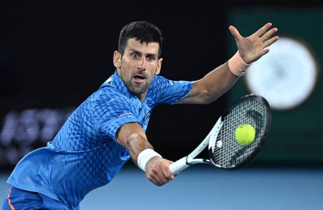 TENNIS AUSTRALIAN OPEN, Novak Djokovic of Serbia returns during the men?s singles final against Stefanos Tsitsipas of Greece at the 2023 Australian Open tennis championship at Melbourne Park in Melbourne, Sunday, January 29, 2023. ( NO ARCHIVING, EDITORIAL USE ONLY, NO USE IN BOOKS WITHOUT CONSENT MELBOURNE VICTORIA AUSTRALIA  Copyright: xJamesxRossx 20230129001757909451