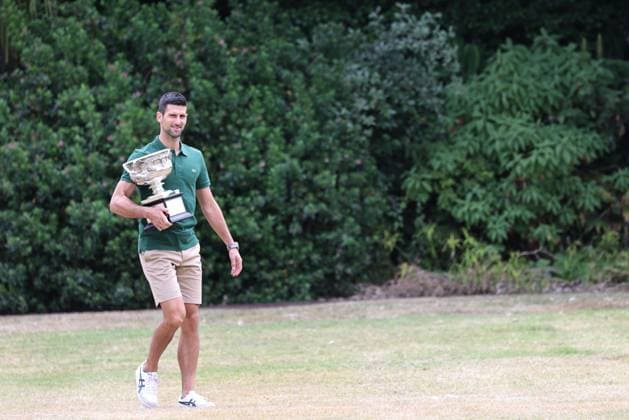 Novak Djokovic, SRB, presenting his trophy in the governmental house gardens after the 2023 Australian Open in Melbourne, 30 01 2023; -