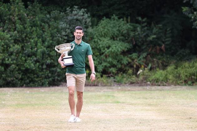 Novak Djokovic, SRB, presenting his trophy in the governmental house gardens after the 2023 Australian Open in Melbourne, 30 01 2023; -