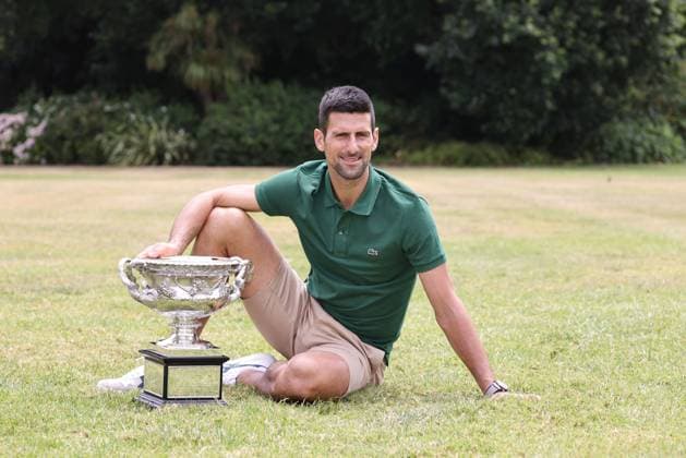 Novak Djokovic, SRB, presenting his trophy in the governmental house gardens after the 2023 Australian Open in Melbourne, 30 01 2023; -