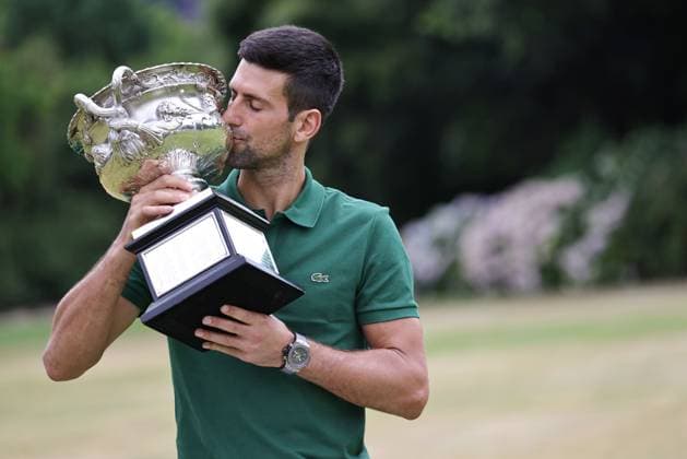 Novak Djokovic, SRB, presenting his trophy in the governmental house gardens after the 2023 Australian Open in Melbourne, 30 01 2023; -