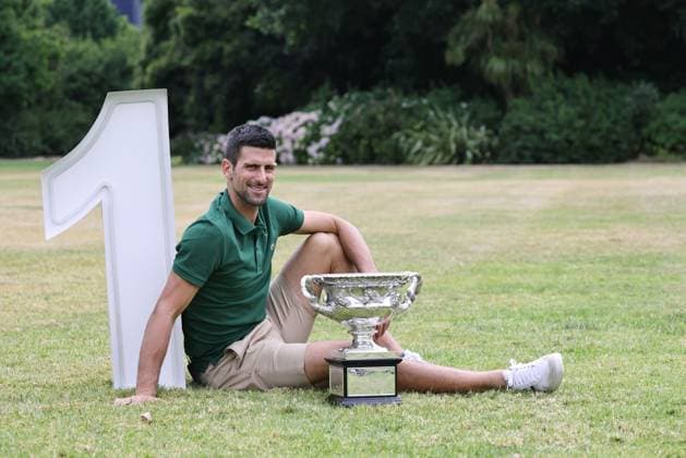 Novak Djokovic, SRB, presenting his trophy in the governmental house gardens after the 2023 Australian Open in Melbourne, 30 01 2023; -