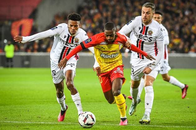 February 1, 2023, Lens, France, France: Hicham BOUDAOUI of Nice, David PEREIRA DA COSTA of Lens and Aaron RAMSEY of Nice during the Ligue 1 match between RC Lens and OGC Nice at Bollaert-Delelis Stadium on February 01, 2023 in Lens, France. Lens France - ZUMAm308 20230201_zsp_m308_001 Copyright: xMatthieuxMirvillex