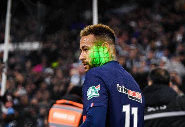 (230209) -- MARSEILLE, Feb. 9, 2023 -- Paris Saint-Germain s Neymar gets pointed by a green laser before kicking a corner during the French Cup round of 16 football match between Olympique de Marseille (OM) and Paris Saint-Germain (PSG) at the Velodrome stadium in Marseille, Feb. 8, 2023. (Photo by Clement Mahoudeau Xinhua) (SP)FRANCE-MARSEILLE-FOOTBALL-FRENCH CUP-PSG VS OM CxLEMENTMAHOUDEAUgaojing 