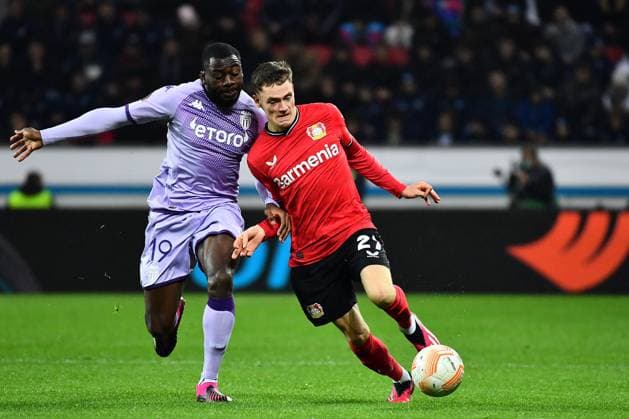 Sport Bilder des Tages LEVERKUSEN, GERMANY - 16.02.23: Youssouf Fofana vs Florian Wirtz. The match of match UEFA Europa League Bayer 04 Leverkusen vs AS Monaco FC at Bayarena  Copyright: xVITALIIxKLIUIEVx