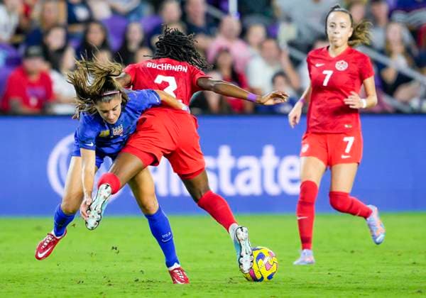 ORLANDO, FL - FEBRUARY 16: the United States forward Alex Morgan (13) and Canada defender Kadeisha Buchanan (3) fight for possession during the She Believes soccer match between the USA and Canada on February 16, 2022 at Explorer Stadium in Orlando, FL. (Photo by Andrew Bershaw Icon Sportswire) SOCCER: FEB 16 Women™s SheBelieves Cup - USA vs Canada Icon2302160086