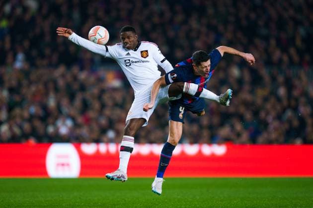 (230217) -- BARCELONA, Feb. 17, 2023 -- Robert Lewandowski (R) of Barcelona vies with Tyrell Malacia of Manchester United, ManU during an Europa League football match between Barcelona and Manchester United in Barcelona, Spain, Feb. 16, 2023. (Photo by Gosa Xinhua) (SP)SPAIN-BARCELONA-FOOTBALL-UEFA-EUROPA LEAGUE-BARCELONA VS MANCHESTER UNITED Joan 