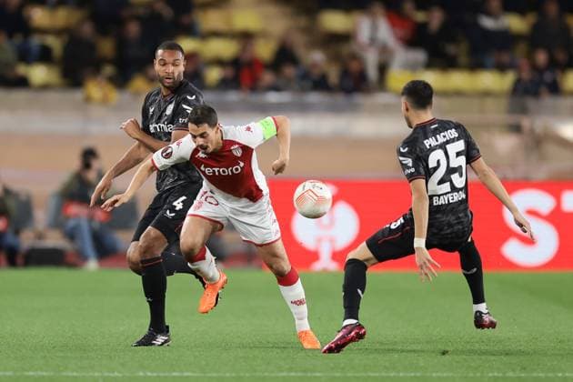 Monaco, Monaco, 23rd February 2023. Exequiel Palacios of Bayer Leverkusen looks on as team mate Jonathan Tah challenges Wissam Ben Yedder of AS Monaco during the UEFA Europa League match at Stade Louis II, Monaco. Picture credit should read: Jonathan Moscrop Sportimage EDITORIAL USE ONLY. No use with unauthorised audio, video, data, fixture lists, club league logos or live services. Online in-match use limited to 120 images, no video emulation. No use in betting, games or single club league player publications. SPI-2233-0004