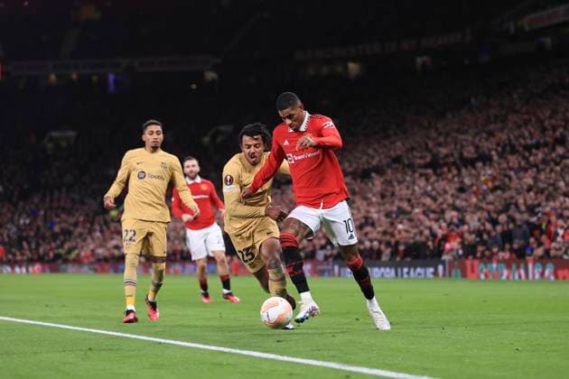Football - UEFA Europa League - Round of 32 (2nd Leg) - Manchester United, ManU v FC Barcelona, Barca 23rd February 2023 - UEFA Europa League - Round of 32 (2nd Leg) - Manchester United v FC Barcelona - Marcus Rashford of Manchester United under pressure from Jules Kounde of Barcelona - Photo: Simon Stacpoole Offside. Manchester UK Copyright: xSimonxStacpoolexOffside