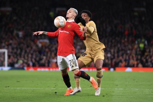 Football - UEFA Europa League - Round of 32 (2nd Leg) - Manchester United, ManU v FC Barcelona, Barca 23rd February 2023 - UEFA Europa League - Round of 32 (2nd Leg) - Manchester United v FC Barcelona - Antony of Manchester United and Jules Kounde of Barcelona - Photo: Simon Stacpoole Offside. Manchester UK Copyright: xSimonxStacpoolexOffside