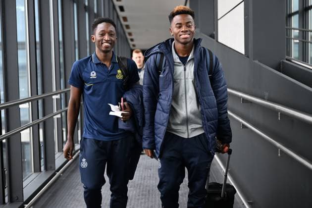 Union s Lazare Amani and Union s Simon Adingra board the airplane for the departure of Belgian soccer team Royale Union Saint-Gilloise, from the airport in Berlin, Germany to Zaventem, Belgium on Friday 10 March 2023. Union is traveling home after yesterday s game against German Union Berlin, the first leg of the round of 16 of the UEFA Europa League competition which ended in a 3-3 draw. LAURIExDIEFFEMBACQ  x62390698x