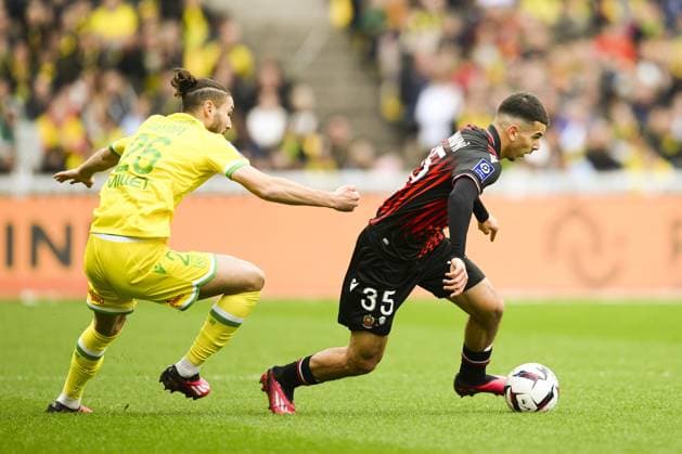 Badredine Bouanani (Nice) vs Jaouen Hadjam (Nantes) FOOTBALL : Nantes vs Nice - Ligue1 - 12 03 2023 JBAutissier Panoramic 
