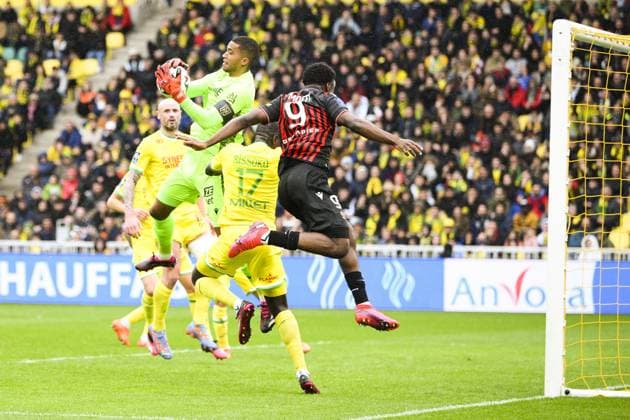 Alban Lafont (Nantes) vs Terem Moffi (Nice) FOOTBALL : Nantes vs Nice - Ligue1 - 12 03 2023 JBAutissier Panoramic 