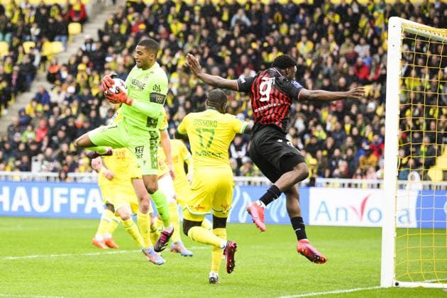 Alban Lafont (Nantes) vs Terem Moffi (Nice) FOOTBALL : Nantes vs Nice - Ligue1 - 12 03 2023 JBAutissier Panoramic 