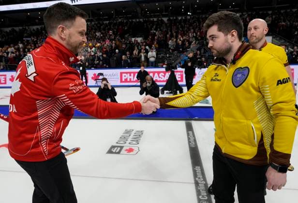 March 12, 2023, London, ON, Canada: Team Canada skip Brad Gushue, left, shakes hands with Team Manitoba skip Matt Dunstone after winning the finals of the 2023 Tim Hortons Brier in London, Ont., Sunday, March 12, 2023. Canada News - March 12, 2023 - ZUMAc35_ 20230312_zaf_c35_034 Copyright: xFrankxGunnx
