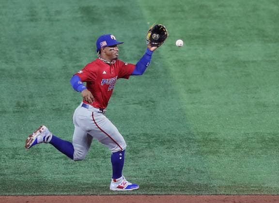 Baseball, World Baseball Classic, Puerto Rico - Mexiko Puerto Rico s Francisco Lindor (12) makes a play on a ball in the second inning during the 2023 World Baseball Classic quarter-final game against Mexico in Miami, Florida on Friday, March 17, 2023.  MIA20230517509 AaronxJosefczyk