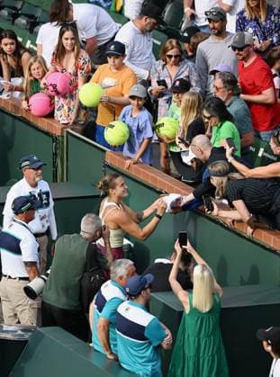 INDIAN WELLS, CA - MARCH 17: Aryna Sabalenka signing autographs after winning a semifinal match and moving onto the finals of the BNP Paribas Open tennis tournament played on March 17, 2023 at the Indian Wells Tennis Garden in Indian Wells, CA. (Photo by John Cordes Icon Sportswire) TENNIS: MAR 17 BNP Paribas Open Icon506230317118
