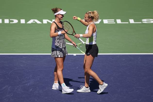 INDIAN WELLS, CA - MARCH 18: Barbora Krejcikova (CZE) and Katerina Siniakova (CZE) embrace after winning the WomenÕs Doubles Final during the BNP Paribas Open on March 18, 2023 at the Indian Wells Tennis Garden in Indian Wells, CA. (Photo by George Walker Icon Sportswire) TENNIS: MAR 18 BNP Paribas Open Icon230318027