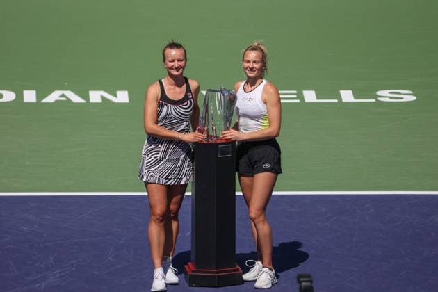 INDIAN WELLS, CA - MARCH 18: Barbora Krejcikova (CZE) and Katerina Siniakova (CZE) pose with the trophy after winning the WomenÕs Doubles Final during the BNP Paribas Open on March 18, 2023 at the Indian Wells Tennis Garden in Indian Wells, CA. (Photo by George Walker Icon Sportswire) TENNIS: MAR 18 BNP Paribas Open Icon230318031