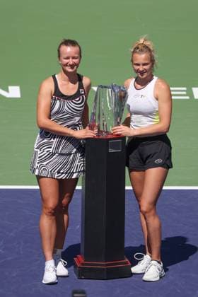 INDIAN WELLS, CA - MARCH 18: Barbora Krejcikova (CZE) and Katerina Siniakova (CZE) pose with the trophy after winning the WomenÕs Doubles Final during the BNP Paribas Open on March 18, 2023 at the Indian Wells Tennis Garden in Indian Wells, CA. (Photo by George Walker Icon Sportswire) TENNIS: MAR 18 BNP Paribas Open Icon230318034
