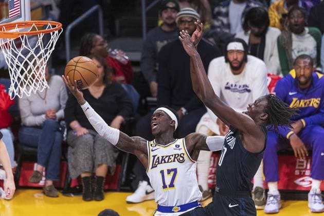 March 19, 2023, Los Angeles, California, USA: Dennis Schroder 17 of the Los Angeles Lakers scores as Bol Bol 10 of the Orlando Magic defends the basket during their NBA, Basketball Herren, USA game on Sunday March 19, 2023 at Crypto.com Arena in Los Angeles, California. Lakers defeat Magic, 110-105. PI Los Angeles USA - ZUMAp124 20230319_zaa_p124_010 Copyright: xARIANAxRUIZx