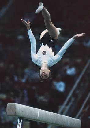 1991. Moscow, USSR. Soviet sportswoman Svetlana Boginskaya performs exercises on the beam in the artistic gymnastics competition to prepare for the 1992 Summer Olympics. The exact date of the photograph is unknown. Robert Maximov TASS  57398363