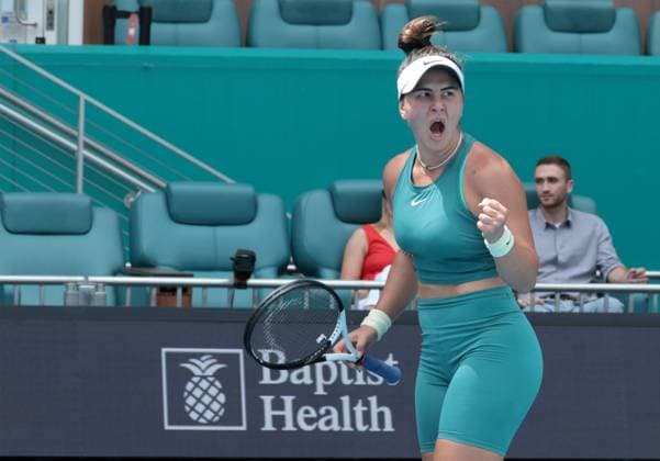 Bianca Andreescu from Canada reacts to winning a game against Emma Raducanu from Great Britain in the first set on opening day of the Miami Open in the Hard Rock Stadium in Miami Gardens, Florida, on Wednesday, March 22, 2023.  MIA202303221032 GARYxIxROTHSTEIN